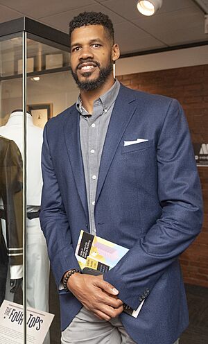 Solomon Hughes next to Four Tops exhibit (cropped).jpg