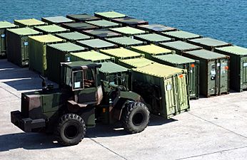 US Navy 051010-M-0596N-001 A tractor moves a quadcon container at Kin Red Port in Okinawa