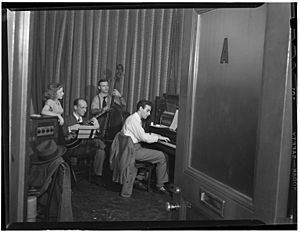 Donn Trenner with Helen Carr, Sammy Herman, Joe Bianco, Nola's, New York, N.Y., ca. Feb. 1947 (William P. Gottlieb 14521).jpg