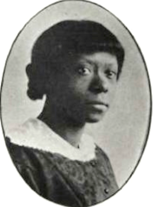 A young Black woman, wearing a white lace-trimmed collar over a dark print dress, in an oval frame