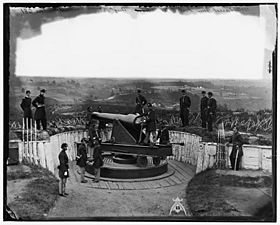 Officers of Companies A and B, 3d Massachusetts Heavy Artillery, and crew of 100-pdr. Parrott gun on iron barbette carriage at Fort Totten