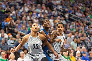 Temi Fagbenle (14) looks for a rebound and is guarded by A'ja Wilson (22) and Tamara Young (1)