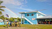 US Navy 090914-N-9689V-001 tudents at the Majuro Cooperative School raise the Republic of Marshall Islands flag at a flag raising ceremony during a Pacific Partnership 2009 community service project