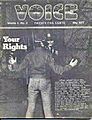 A picture of the black-and-white cover of the May 1977 issue of "The Voice". The word "Voice" is printed in bubble letters at the top of the cover. The cover picture is of a male with his hands extended away from his body as a police officer interacts with him. The cover story's title, "Your Rights", is located on the picture's left-hand side.