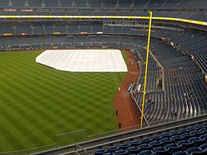 Yankee Stadium with the tarp on the field, before a game, in what became a rain delay