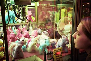 A Claw Crane game machine containing unicorn plushes in Trouville, France, Sept 2011