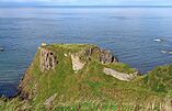 Picture of the ruins of the Findlater Castle in Scotland, partially engraved into a mountain