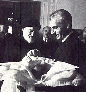 Mohammad Reza Shah and his newborn son, Crown Prince Reza