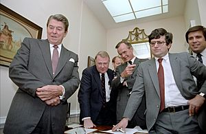 President Ronald Reagan watching the Tax Bill vote with staff in the White House