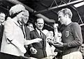 The Queen presents the 1966 World Cup to England Captain, Bobby Moore. (7936243534)