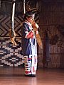 Woman playing traditional Ainu instrument