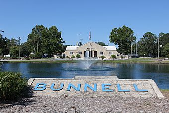 Bunnell Coquina City Hall - Distant Full Front View with Lake Lucille & Fountain.jpg