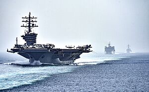CVN 69 transits the Strait of Hormuz (28465403076)