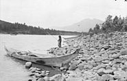 First Nations girl fishing on the Skeena River, 1915