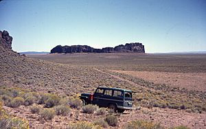 Fort Rock and part of its basin, with a University of Oregon vehicle in the foreground, Lake County, Oregon, United States