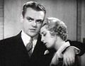 Cagney with his arm around actress Joan Blondell, who has her eyes closed