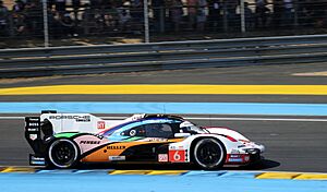 Porsche 963 Hybrid - Kevin Estre, Andre Lotterer & Laurens Vanthoor enters Tertre Rouge at the 2023 Le Mans (53470244984)