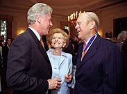 President Bill Clinton talking with former President Gerald Ford and former First Lady Betty Ford at the Medal of Freedom ceremony in the East Room