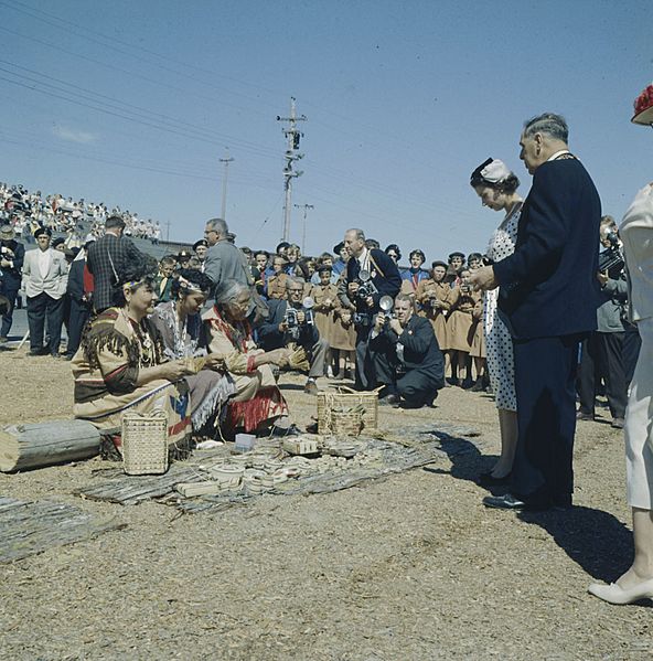 Queen Elizabeth observing basket weaving