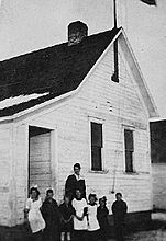 Teacher and students standing next to the Lamoine School in 1918.jpg