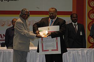 The President Dr, A.P.J. Abdul Kalam giving away the Pravasi Bhartiya Samman Award to Mr C.K.Menon of Qatar for Community Leadership, on the last day of the Pravasi Bharatiya Divas, in Hyderabad on January 9, 2006