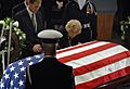US Navy 061230-D-1142M-018 Former First Lady Betty Ford bows her head over her husband's casket during memorial services at the U.S. Capitol Rotunda, for former President Gerald R. Ford
