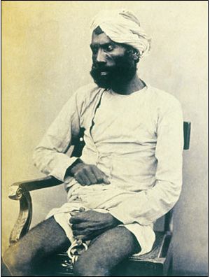 A hand-written caption identifies the man as Gungoo Mehter who was tried at Kanpur for killing many of the Sati Chaura survivors, including many women and children. He was convicted and hanged at Kanpur on 8 September 1859.