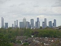 The Canary Wharf and Isle of Dogs business district as viewed from Blythe Hill Fields, London Borough of Lewisham, May 2021. The tallest building in this cluster is One Canada Square with the pyramid-shaped roof which was completed in 1991 and stands at 235m. There are seven towers in this cluster that are at least 200m tall with more planned and under construction. However, due to the proximity of London City Airport it is unlikely that any will exceed the height of One Canada Square