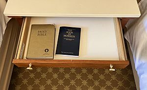 Gideon's Bible beside a Book of Mormon in a JW Marriott Hotel
