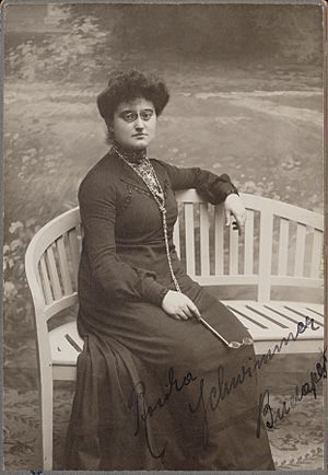 Rosika Schwimmer, seated on bench