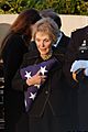 US Navy 040611-N-1450G-059 Former First Lady Nancy Reagan holds onto the flag that covered former President Ronald Reagan's casket as she departs