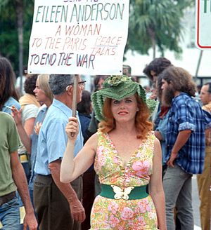 Women protestor with sign- Miami Beach, Florida