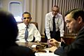 President Barack Obama in a meeting aboard Air Force One en route to New Delhi