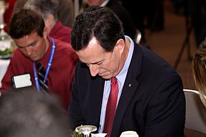 Rick Santorum prays