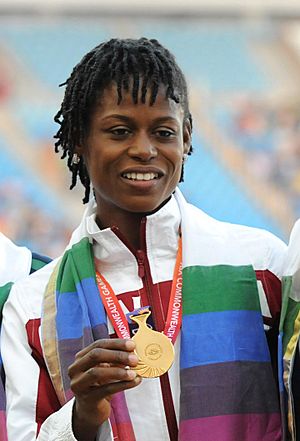 XIX Commonwealth Games-2010 Delhi (Women’s) Athletics Long Jump Alice Falaiye of Canada (Gold), during the medal presentation ceremony (cropped).jpg