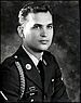 A black and white portrait picture of a Kenneth in his formals with one chevron on his shoulder.