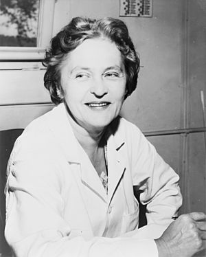 Smiling middle-aged woman dressed in a lab coat.999