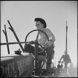 Monterey County, California. Rural youth. Mechanization, the agricultural employee. At the wheel of a farm-all tractor - NARA - 532242