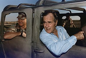 President Bush rides in a HUMVEE with General H. Norman Schwarzkopf during his visit with troops in Saudi Arabia on... - NARA - 186424
