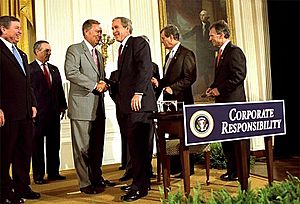 President George W. Bush shakes hands with Congressman Mike Oxley
