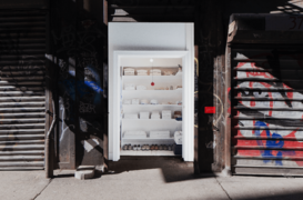 Exhibit featuring white clothing arranged neatly in a closet