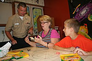 US Navy 110820-N-ZL585-122 A Sailor volunteers at the Camp Dellwood Girl Scout Camp Science Center.jpg