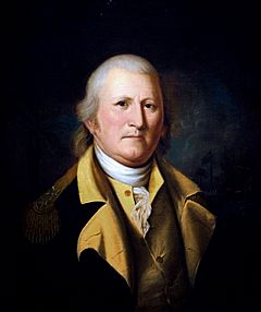 A head and shoulders portrait of William Moultrie.  Painted in middle age, he wears a military uniform jacket that is blue with gold trim.
