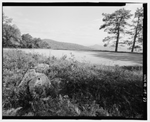 DOYLES RIVER OVERLOOK, STUMP AND GRASS IN FOREGROUND. LOFT MOUNTAIN AND LITTLE FLAT MOUNTAIN IN BACKGROUND. LOOKING NORTHEAST, MILE 81.9. - Skyline Drive, From Front Royal, VA HAER VA,70-LURA.V,4-83