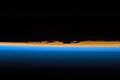 Layers of Earth's atmosphere, brightly colored as the sun sets