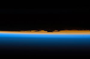 Layers of Earth's atmosphere, brightly colored as the sun sets