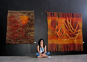 Lorena Lemunguier Quezada junto a sus obras