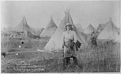 Young-Man-Afraid-of-His-Horses (Tashun-Kakokipa), an Oglala Sioux, standing in front of his lodge, Pine Ridge, South Dak - NARA - 530813