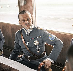 Marshal of Finland Carl Gustaf Emil Mannerheim having a cigar in a train during his visit in Germany, 1942. (49960472022)
