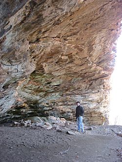 Rockhouse Hollow shelter with human for scale, interior